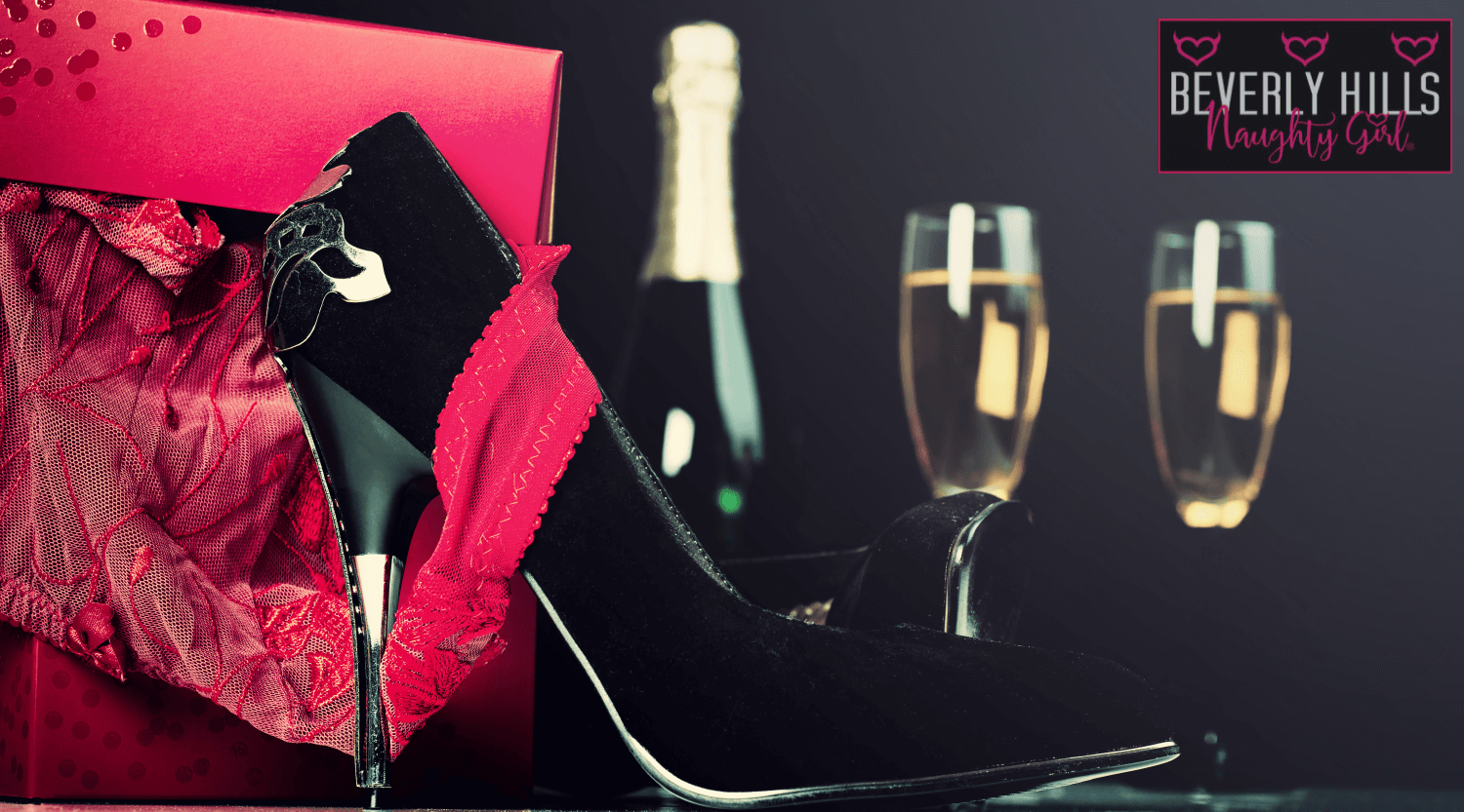 red-lingerie-in-gift-box-high-heels-champagne-and-glasses-valentine-day-love-concept